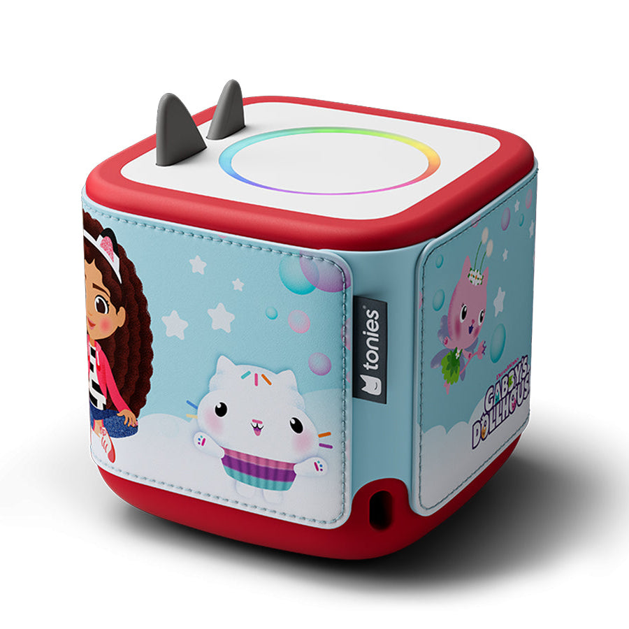 Toy cube with cartoon characters and colorful design on a white background