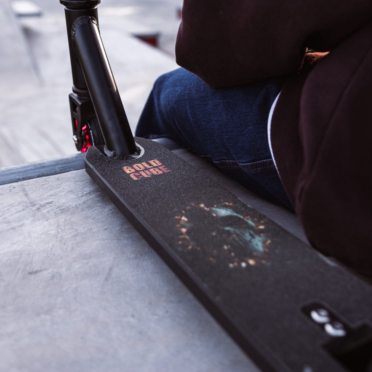 Close-up of a skateboard with 'Bolt' branding on a concrete surface.