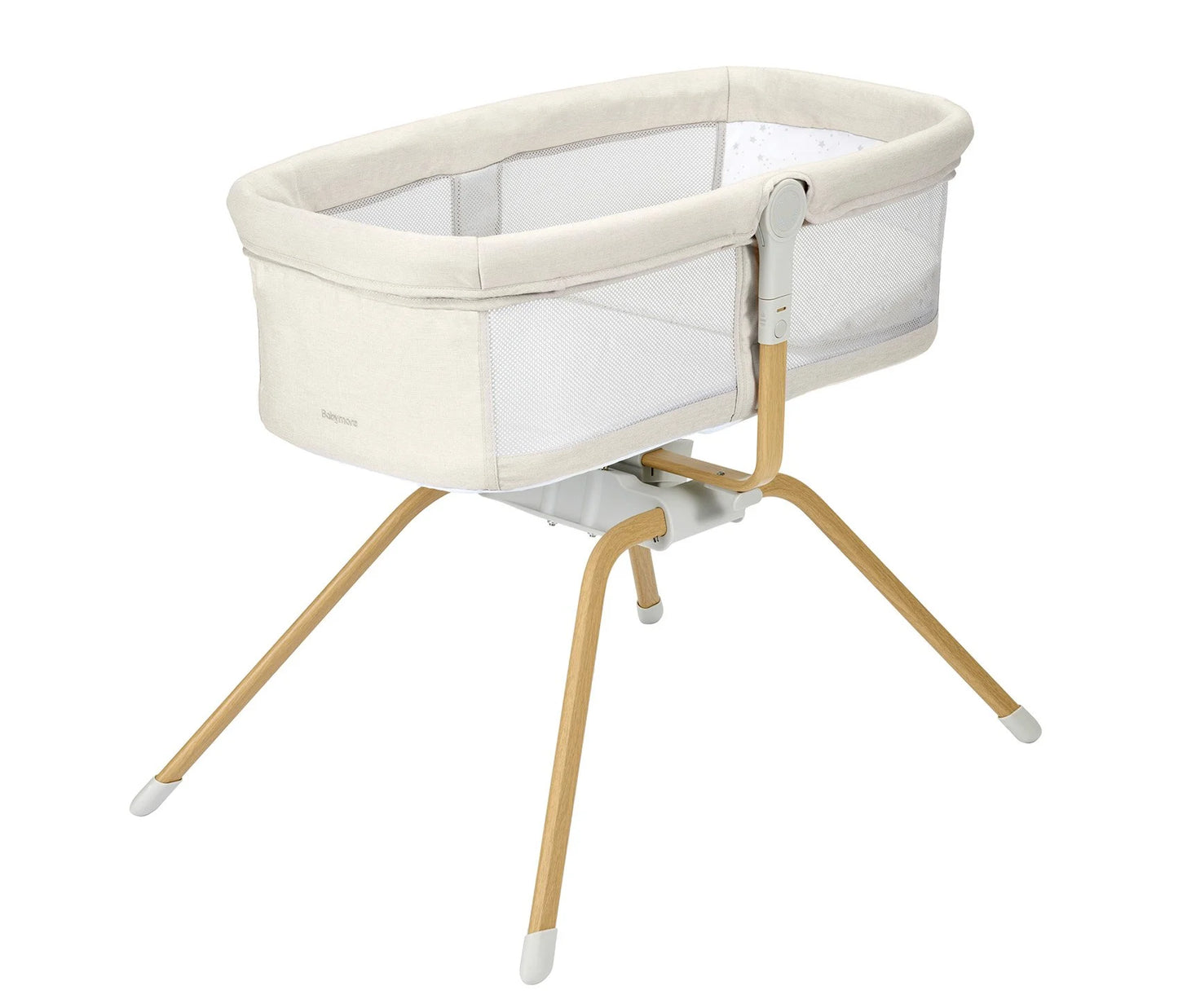 Baby crib with beige fabric and wooden legs on a white background