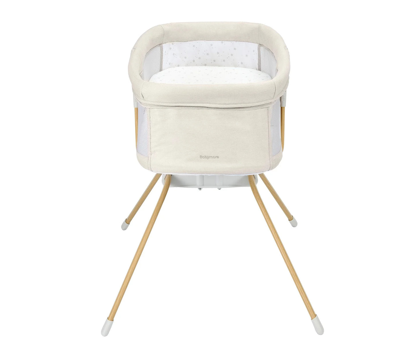Baby crib with beige mattress and wooden legs on a white background