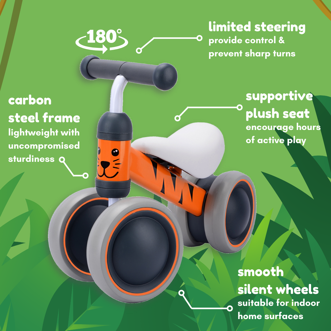 Children's balance bike with features highlighted on a green background