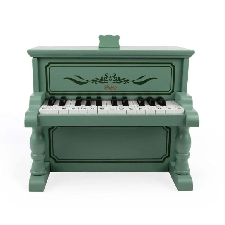 Green toy piano with keyboard on a white background