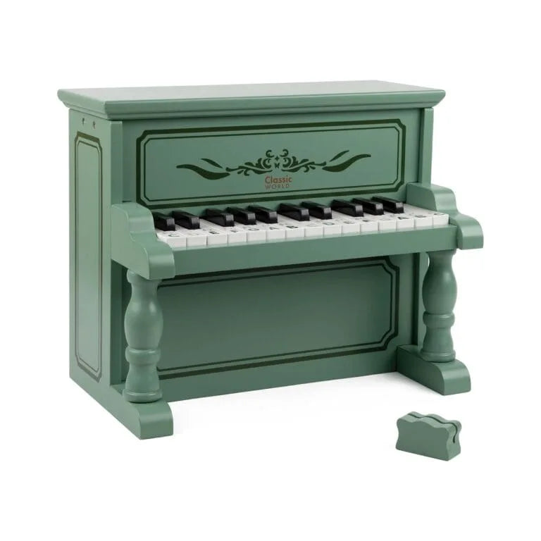 Green toy piano with white and black keys on a white background