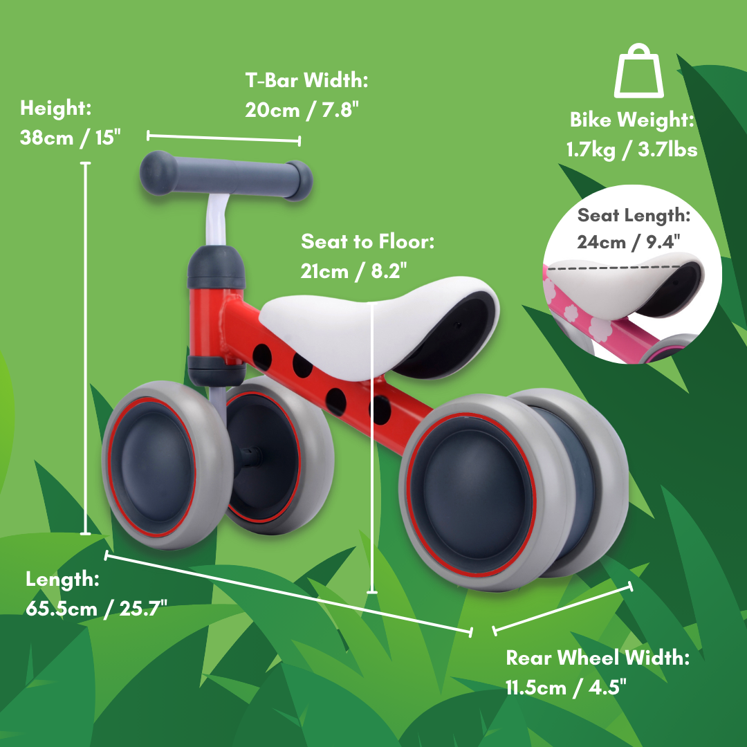 Red and white balance bike with measurements on a green leafy background
