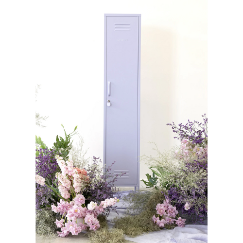 Light purple door with floral decorations on a white background