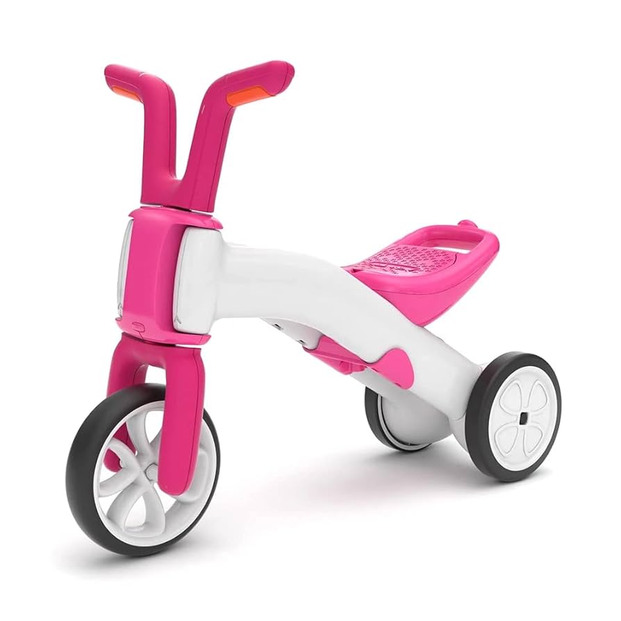 Pink and white tricycle on a white background
