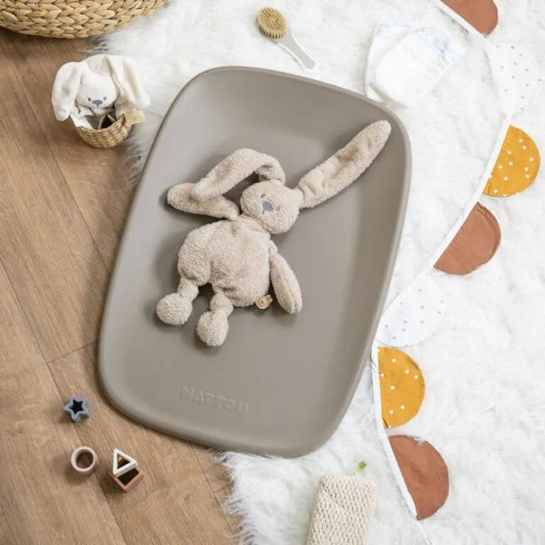 Toy rabbit on a changing mat