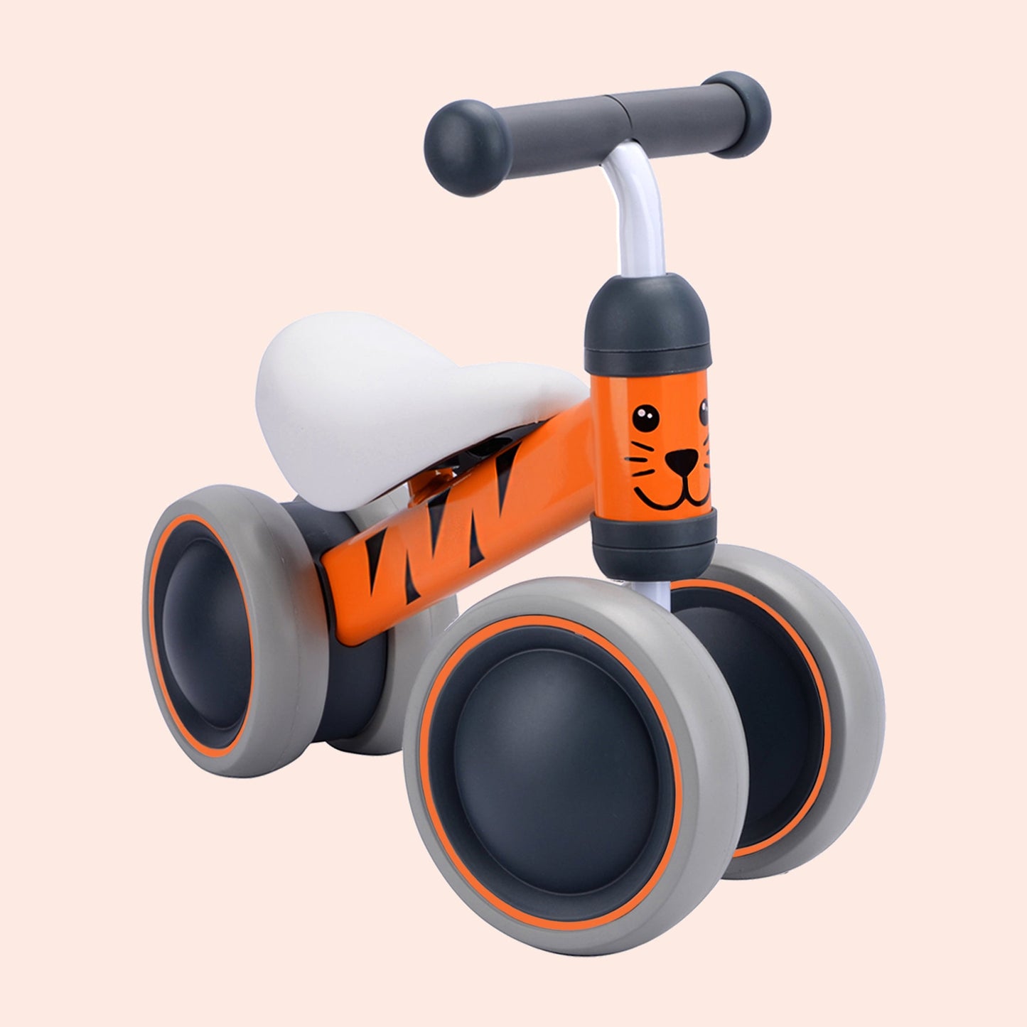 Children's balance bike with orange and gray design on a beige background