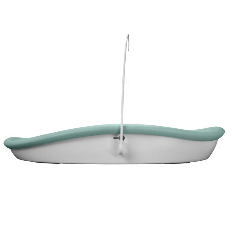 Green changing pad with a hook on a white background