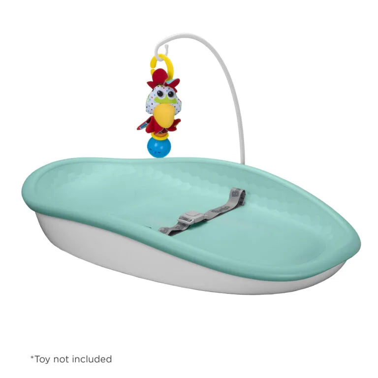 Green changing pad with a hook on a white background