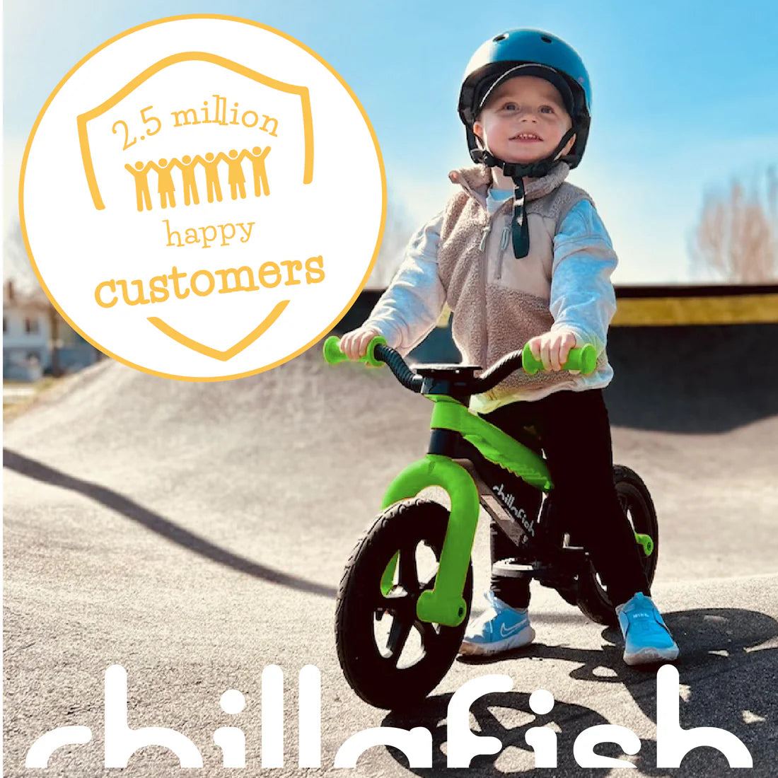 Child riding a green balance bike with a '2.5 million happy customers' badge and 'chillafish' branding.