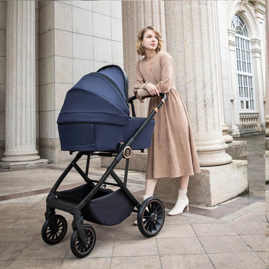 Woman pushing a blue stroller in an elegant outdoor setting