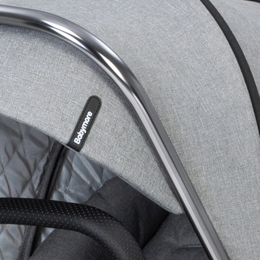 Close-up of a gray baby carrier with a visible Babymoov label.