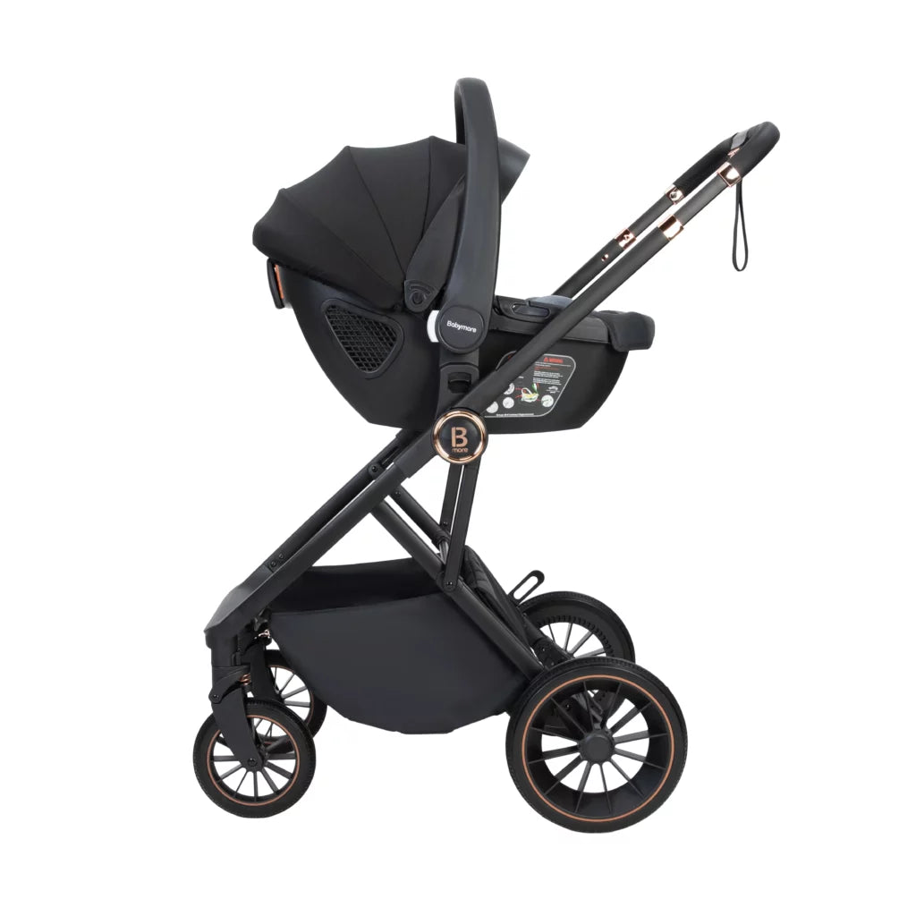 Black baby stroller with car seat on a white background