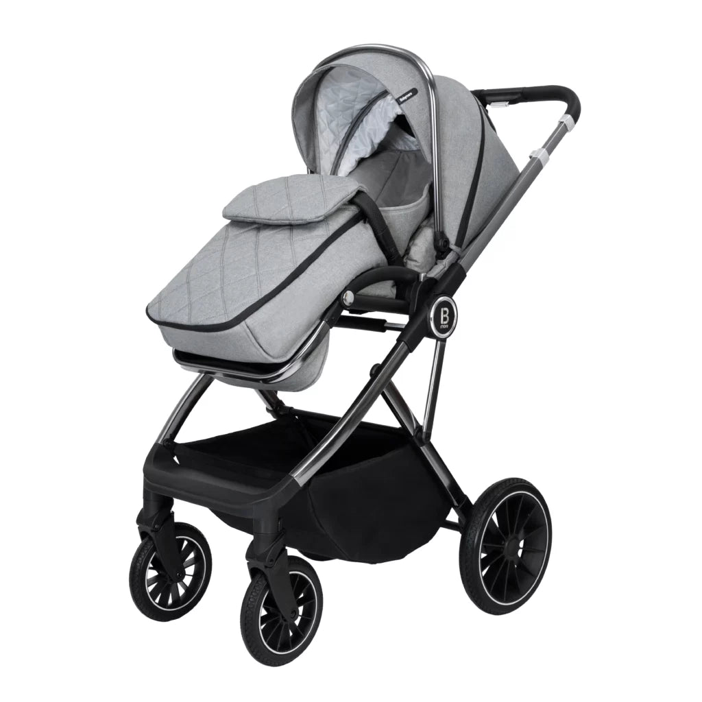 Gray baby stroller with a quilted seat on a white background