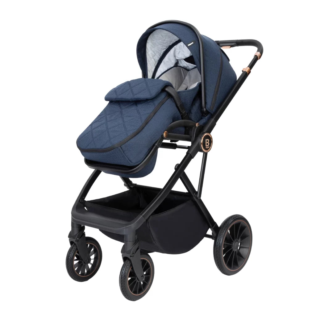 Navy blue baby stroller with quilted seat cover on a white background