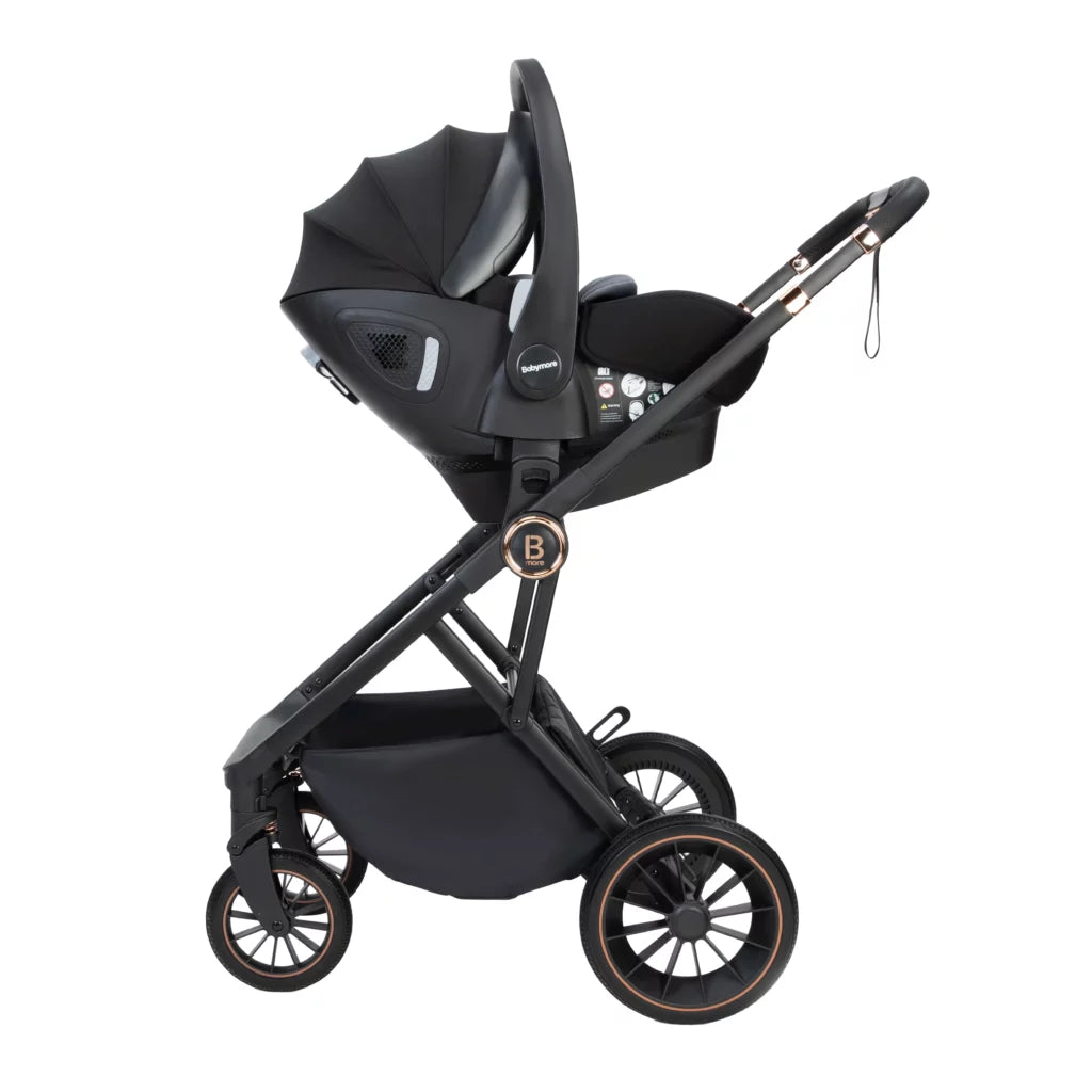 Black stroller with car seat attachment on a white background