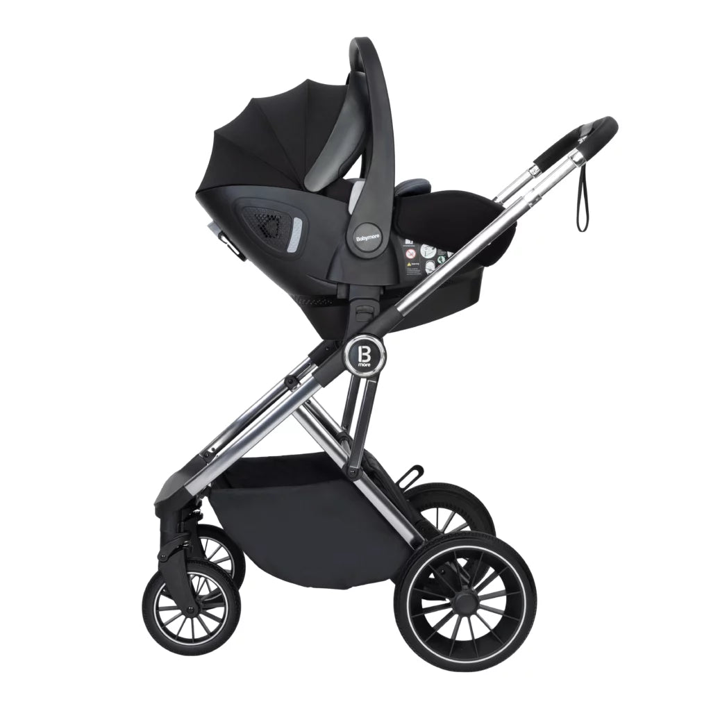 Black baby stroller with car seat on a white background