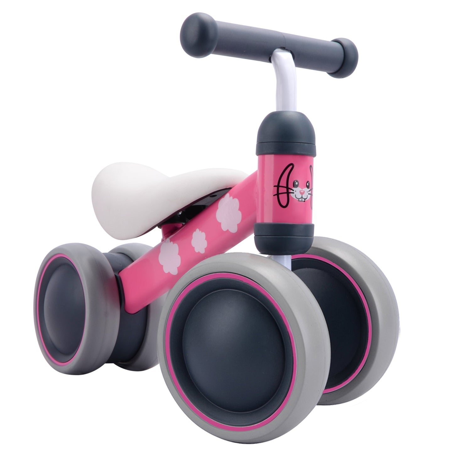 Pink and gray balance bike with paw print design on a white background