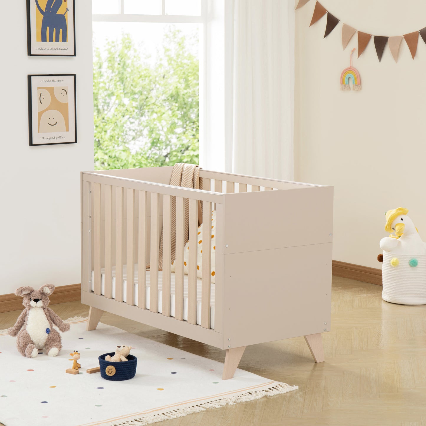 Nursery room with a cot, toys, and decorative elements.