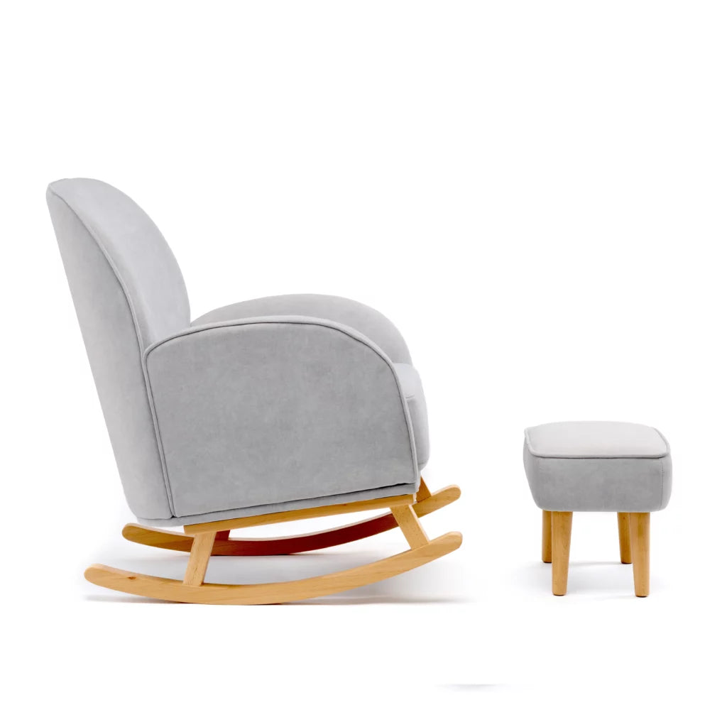 Gray rocking chair with wooden legs and matching ottoman on a white background