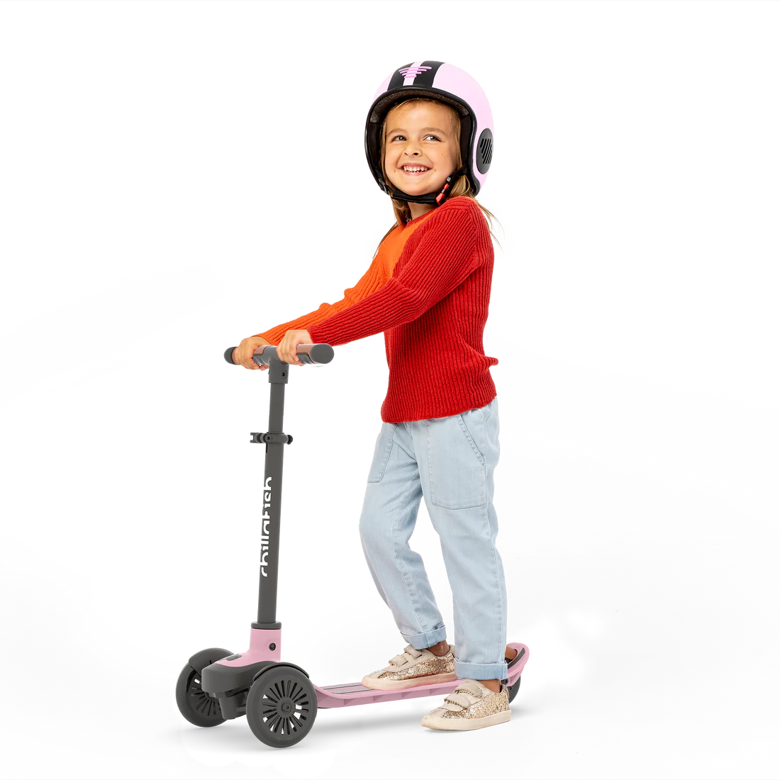 Child riding a scooter with a helmet on a white background