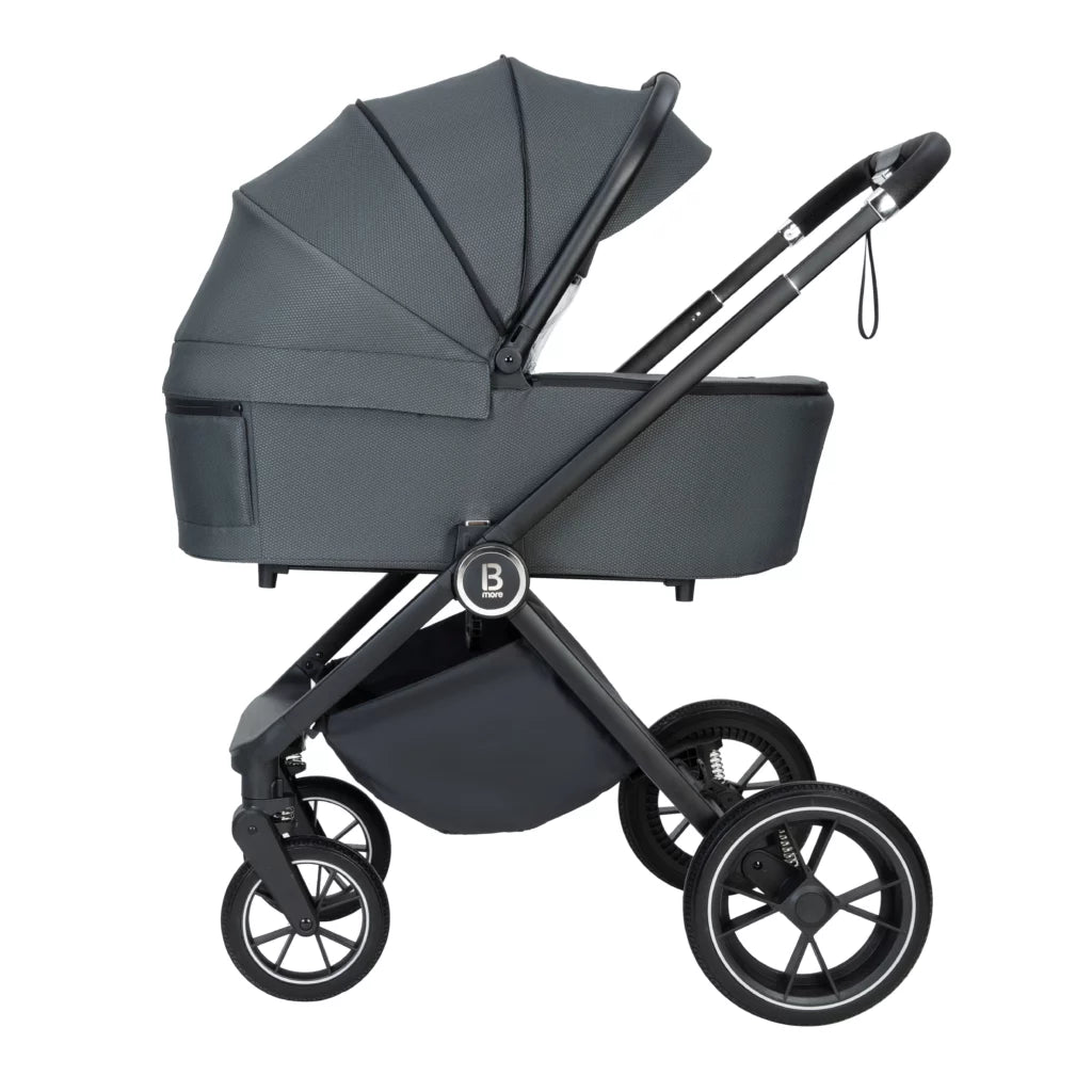 Dark gray stroller with black wheels on a white background