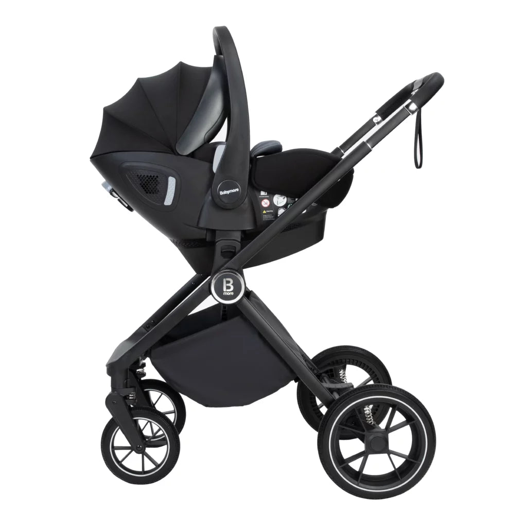 Black baby stroller with car seat on a white background