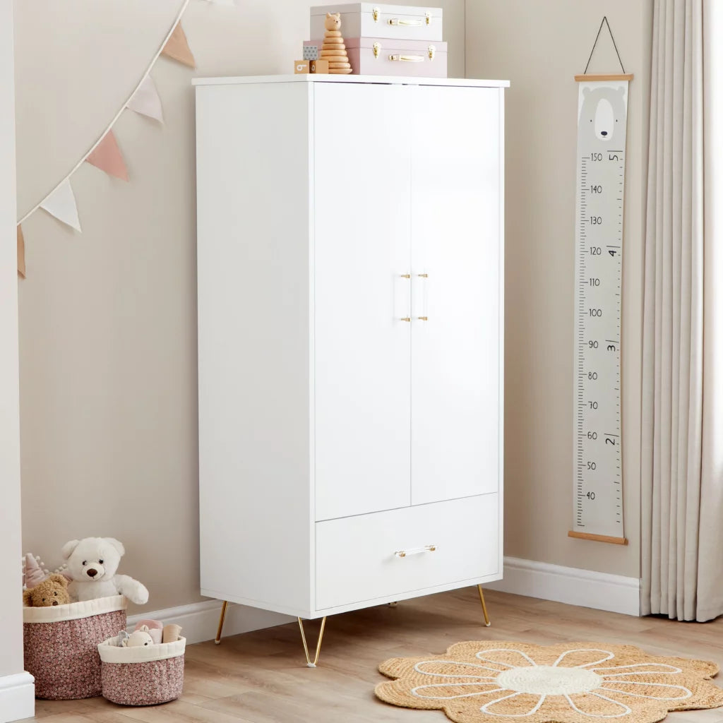 White cabinet in a child's room with toys and decor