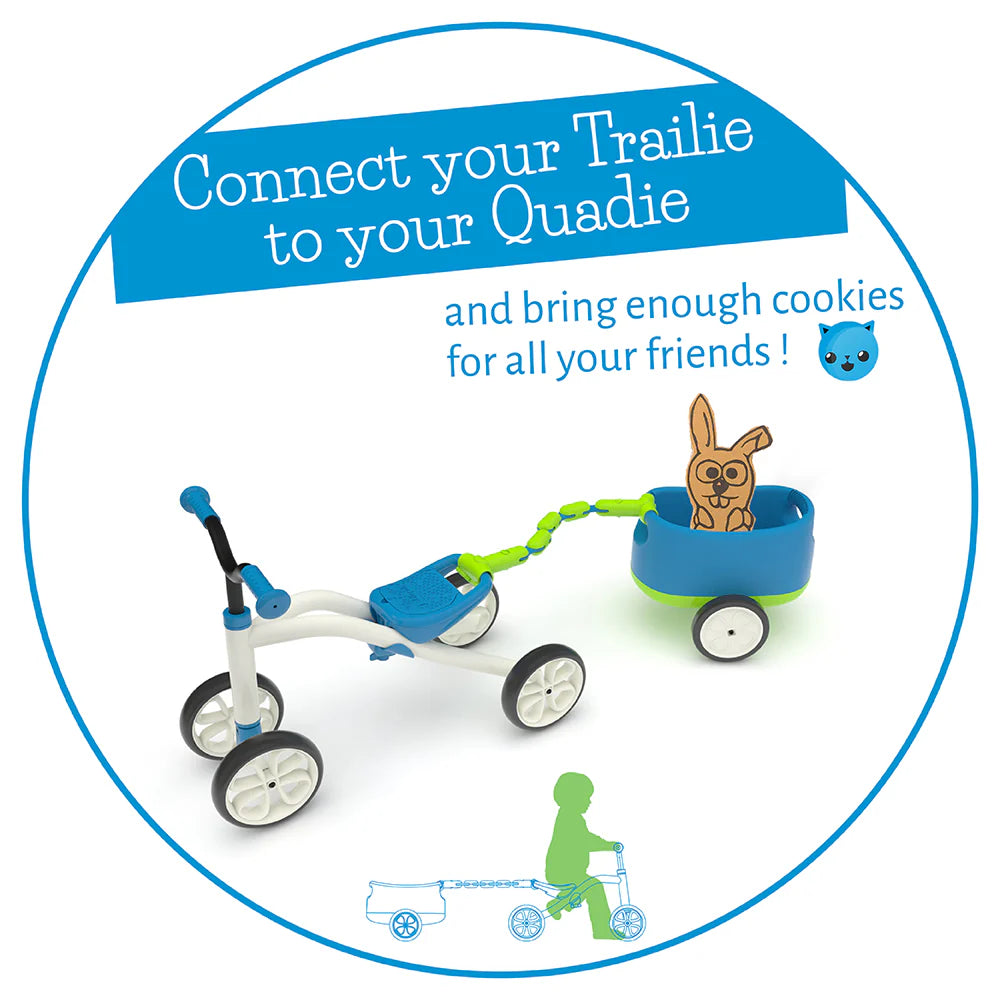 Children's tricycle with a trailer and cartoon character, promoting 'Trailie' and 'Quadie' products.
