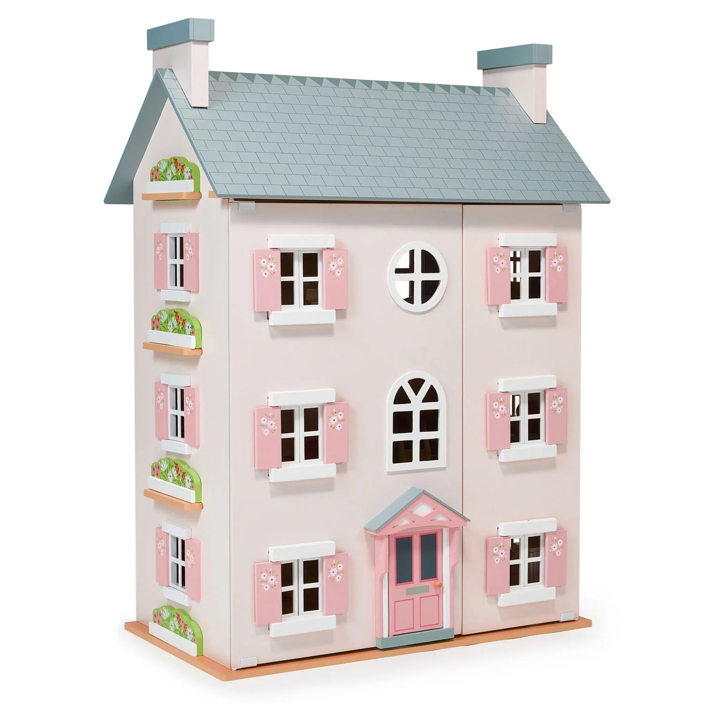 Wooden dollhouse with pink shutters and a gray roof on a white background