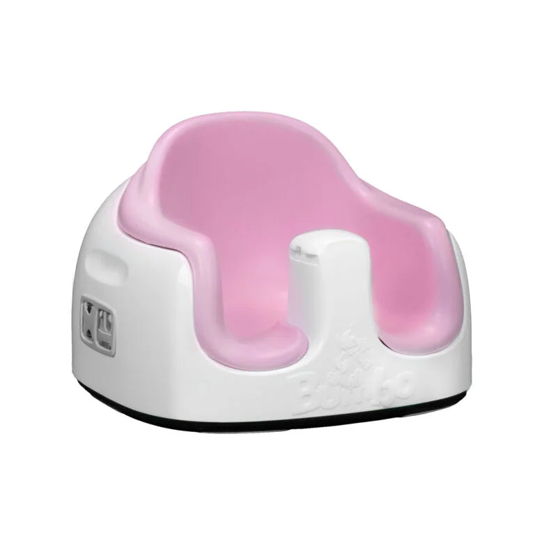 Pink and white baby seat on a white background
