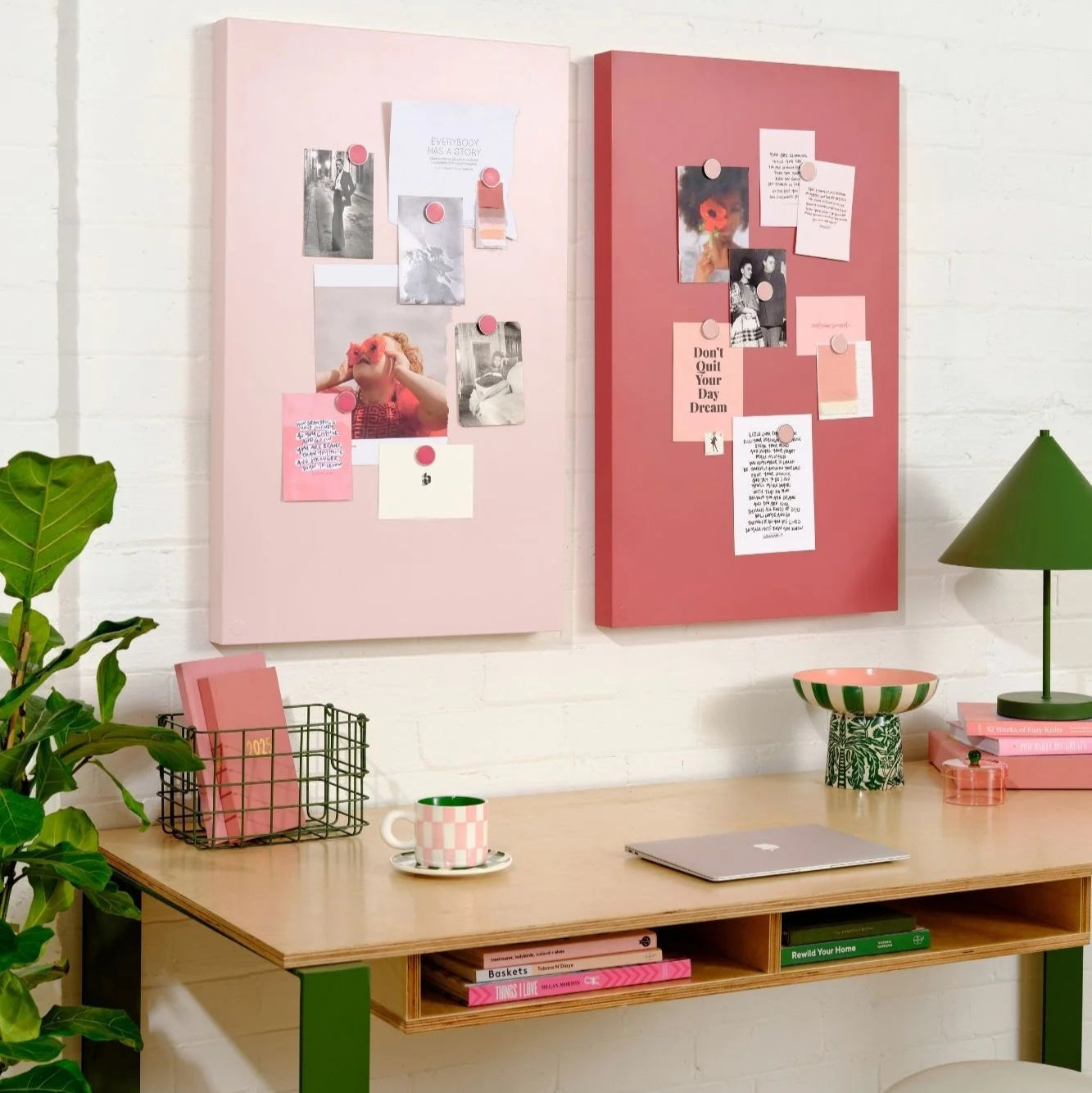 Home office setup with pink and red bulletin boards, desk, and decor items.