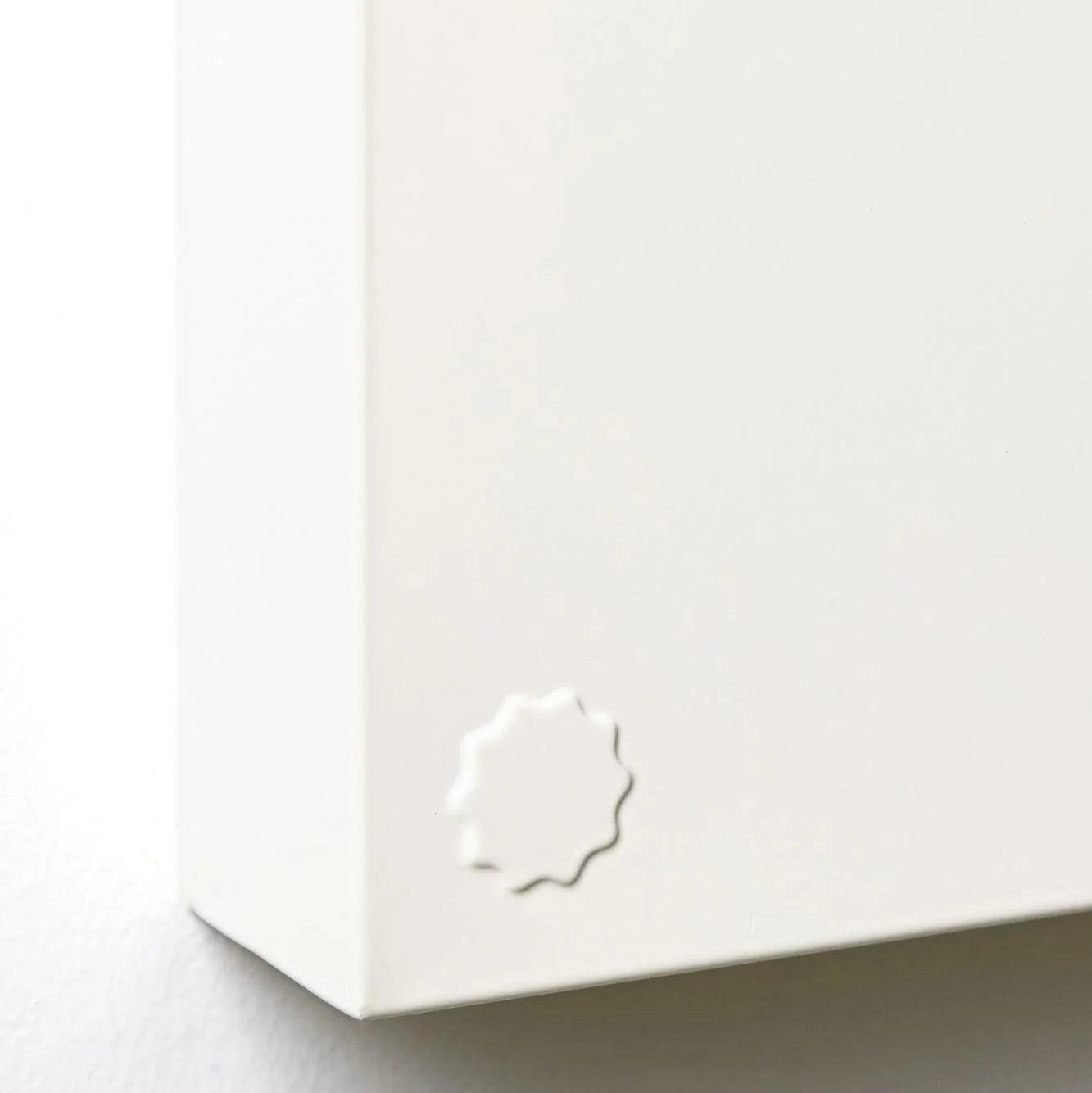 White product with a logo on a light gray background