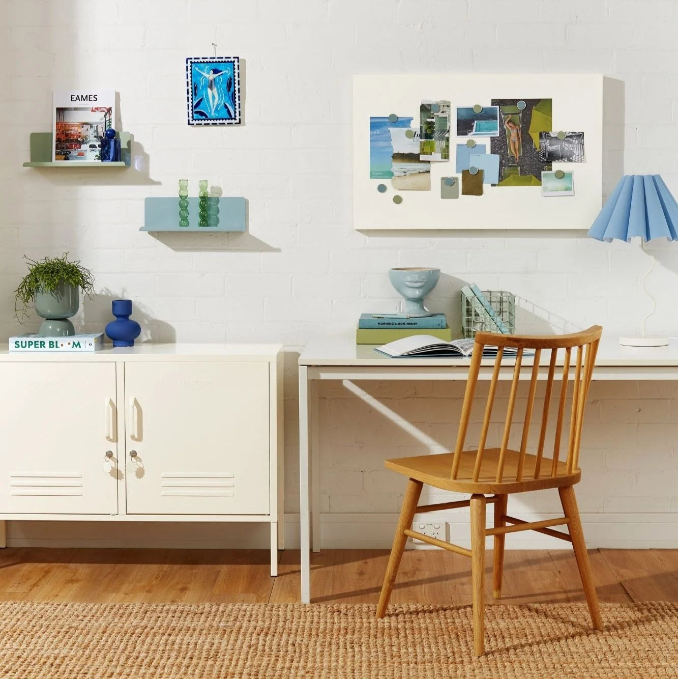 Modern home office with a desk, chair, and shelves.