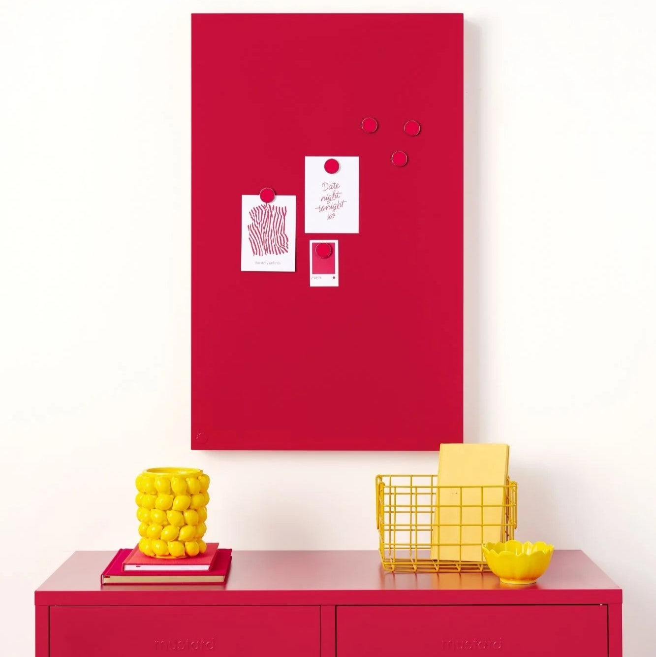 Red locker with a red magnetic board above, containing various small items, on a white background.