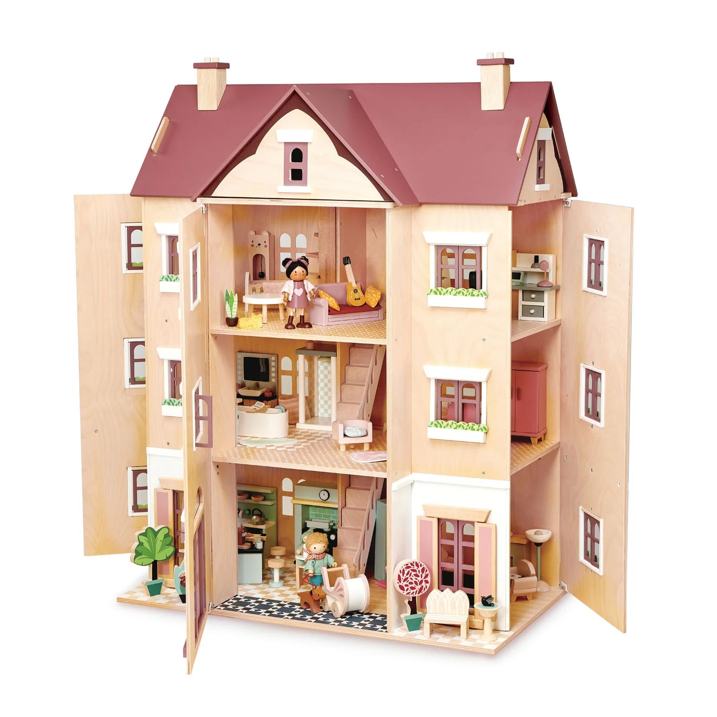 Wooden dollhouse with multiple rooms and furniture on a white background