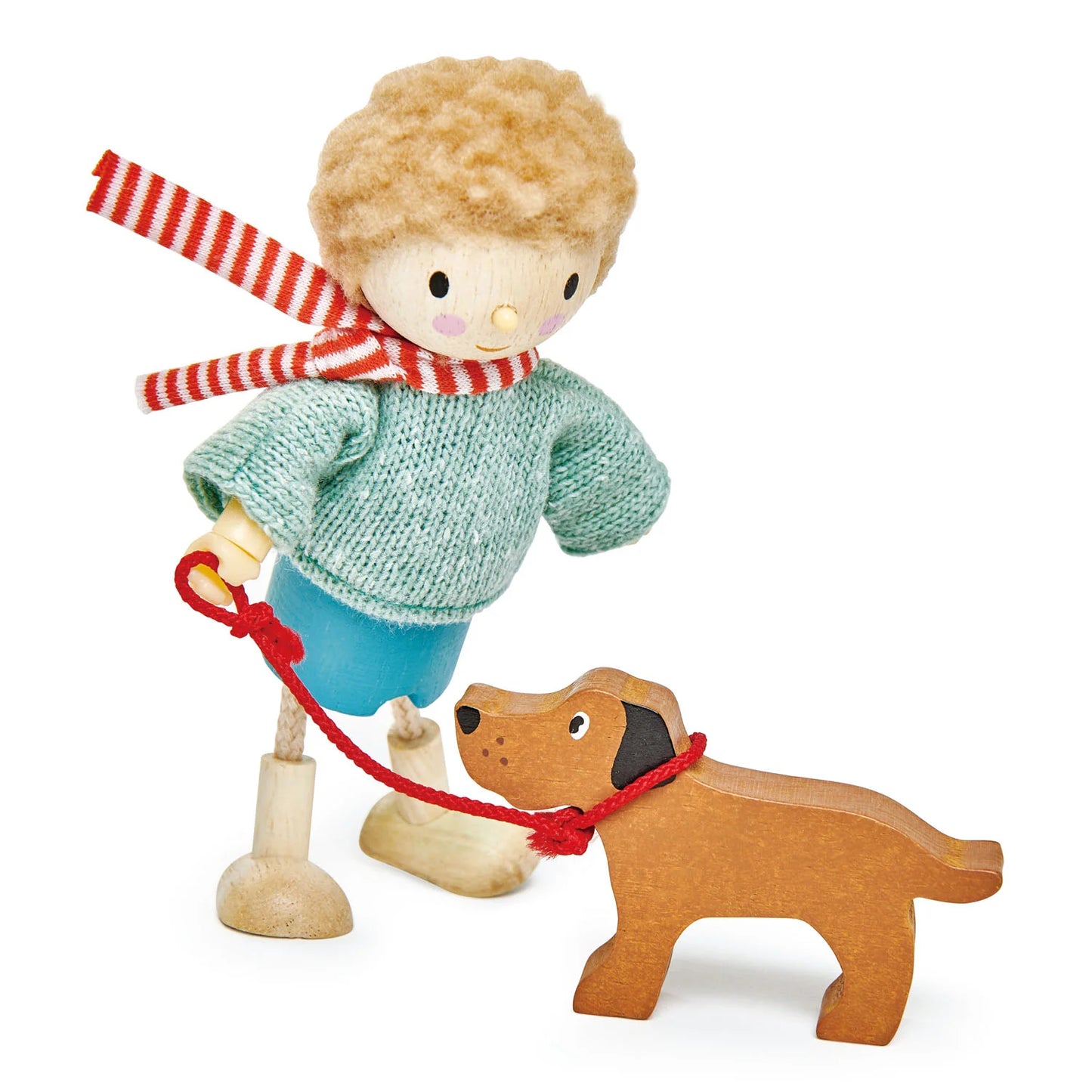 Wooden toy figure of a boy with a red and white striped scarf and a wooden dog on a white background