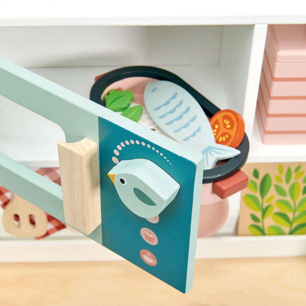 Children's book with a bird illustration on a shelf with other books