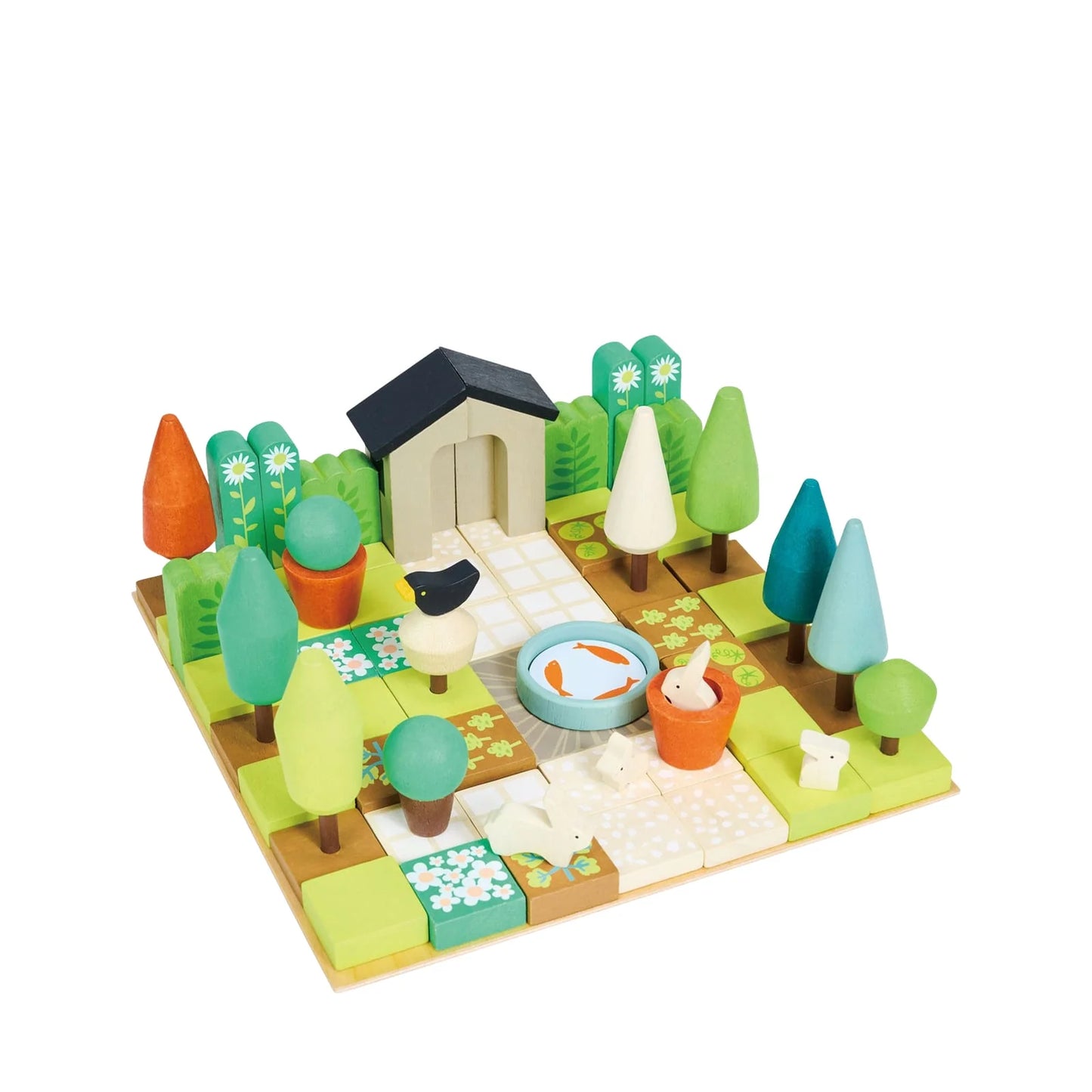 Toy set with a small house, trees, and animals on a white background