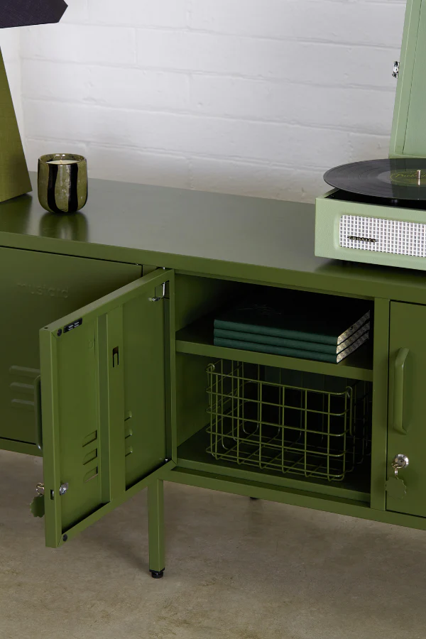 Green metal storage cabinet with open door revealing shelves and a basket.