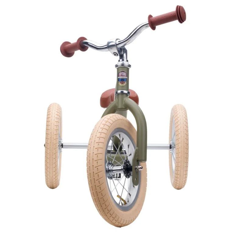 Children's balance bike with large wheels on a white background