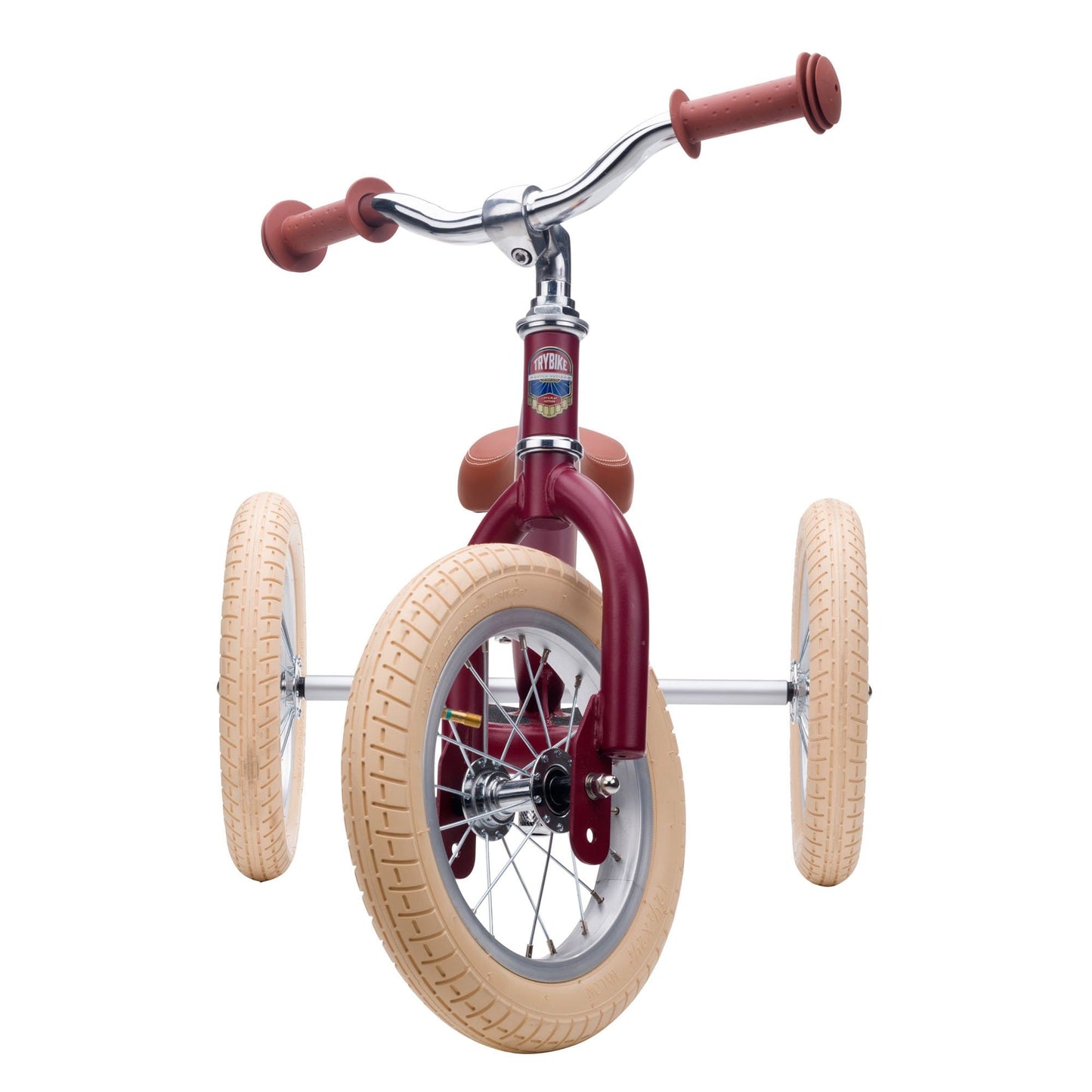 Children's balance bike with maroon frame and beige tires on a white background