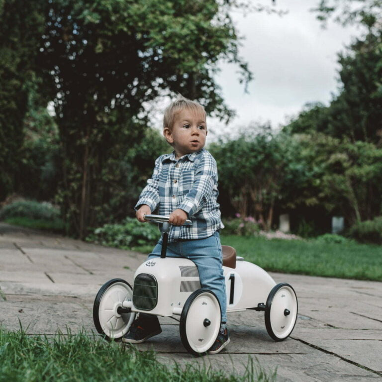 Ride on car with number 1 on the side with child riding on it