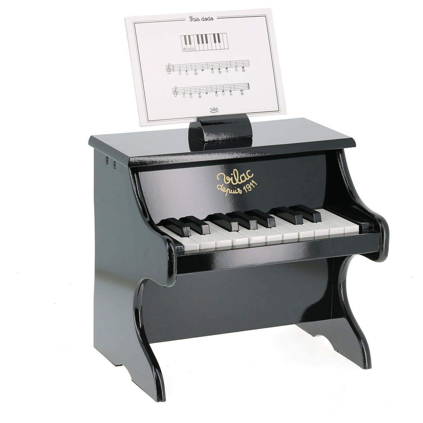 Toy piano with music stand on a white background