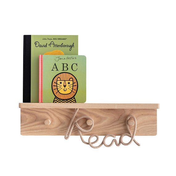 Wooden shelf with books and a decorative 'read' sign on a white background