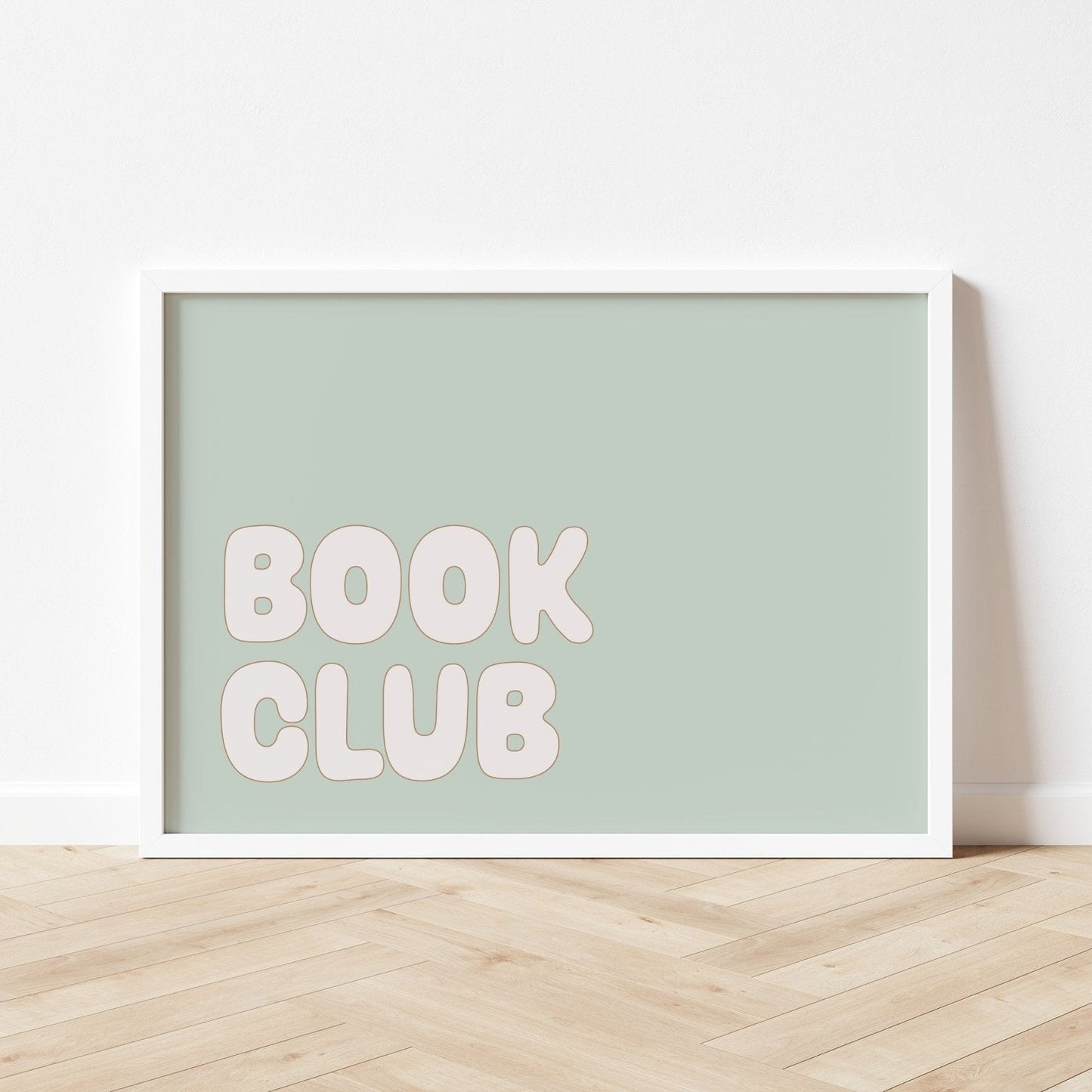 Framed poster with 'BOOK CLUB' text on a light green background