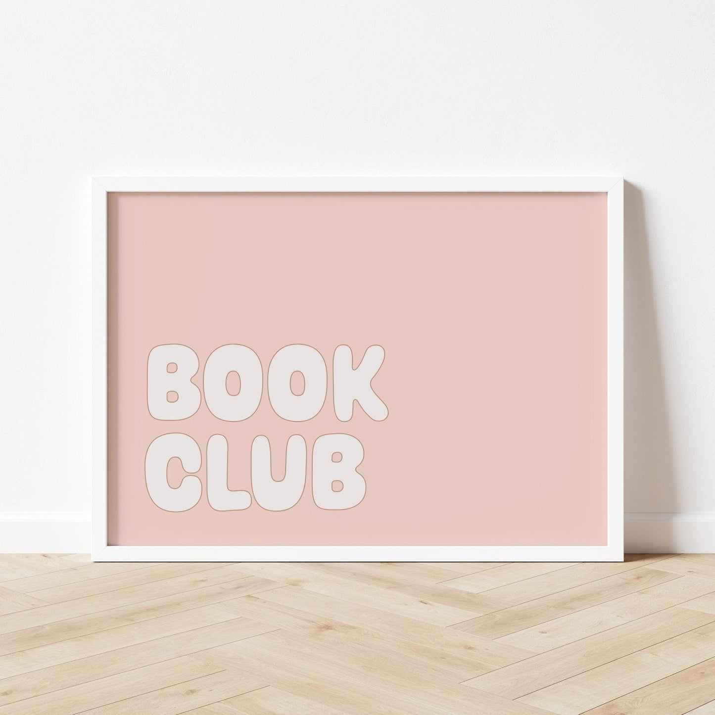 Framed poster with 'BOOK CLUB' text on a light pink background