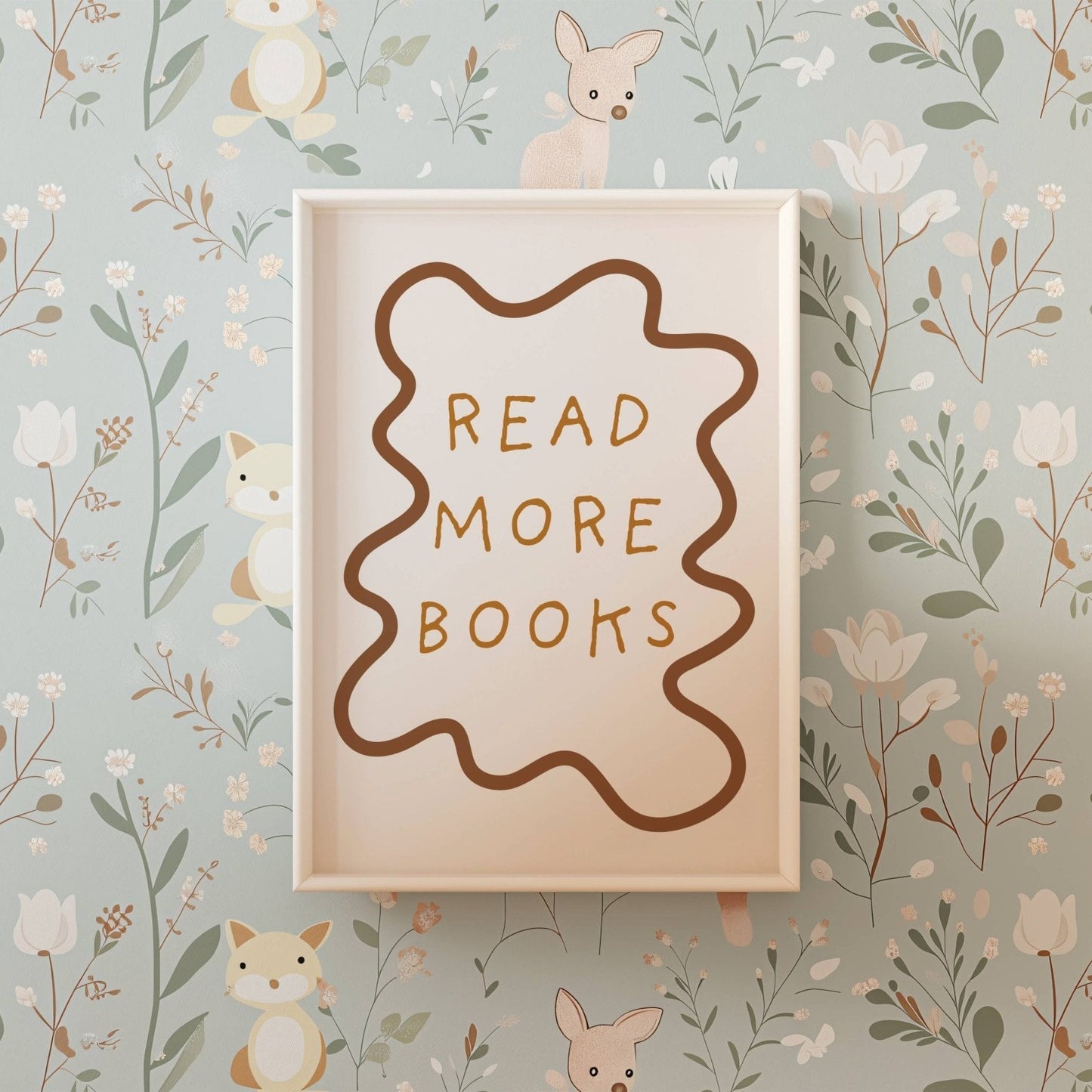 Wooden sign with 'Read More Books' text on a floral and animal wallpaper background