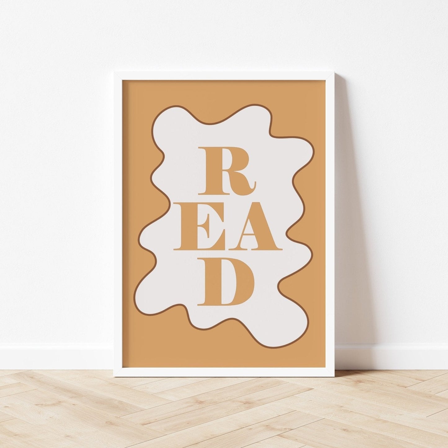 Decorative wall art with 'READ' text on a wooden surface and white wall background